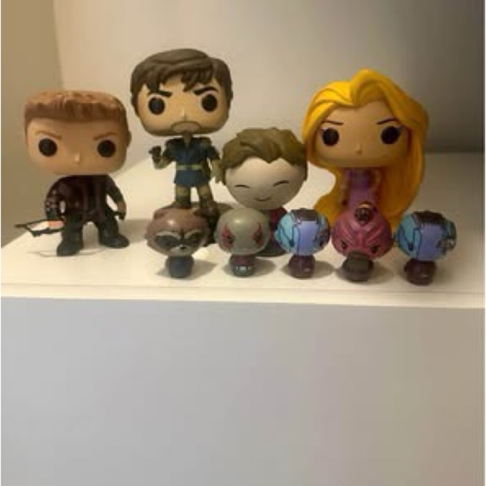 Funko Pop Figures with Brown, Blue, and Purple Accents